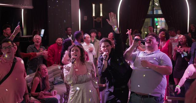 Broadway performers and guests singing together at Sing with the Stars