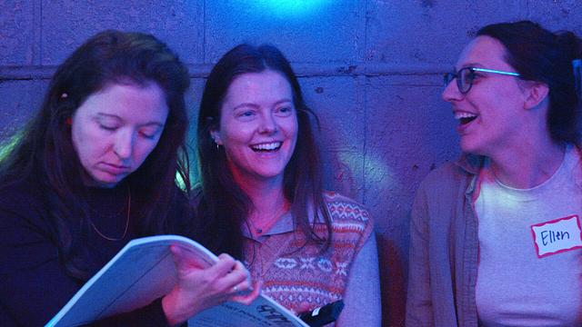 Guests laughing together at a Sing with the Stars night