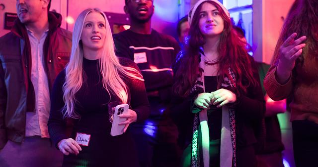 Friends laughing and singing together at an intimate Sing with the Stars night